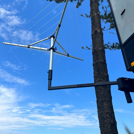BBQARM camp clothesline setup with folding clothesline adapter mounted to caravan drawbar – secure, space-saving solution for drying clothes while camping or caravanning in Australia.