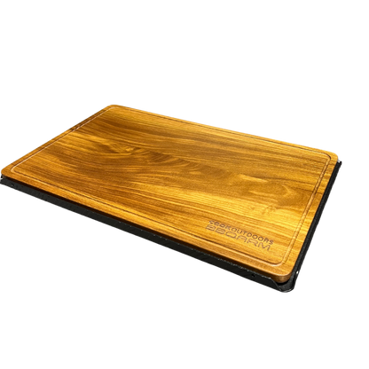 BBQARM teak cutting board sitting in BBQARM tray for caravan and camping outdoor food preparation